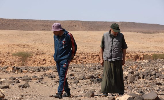 two men seeking everywhere for archeological finds